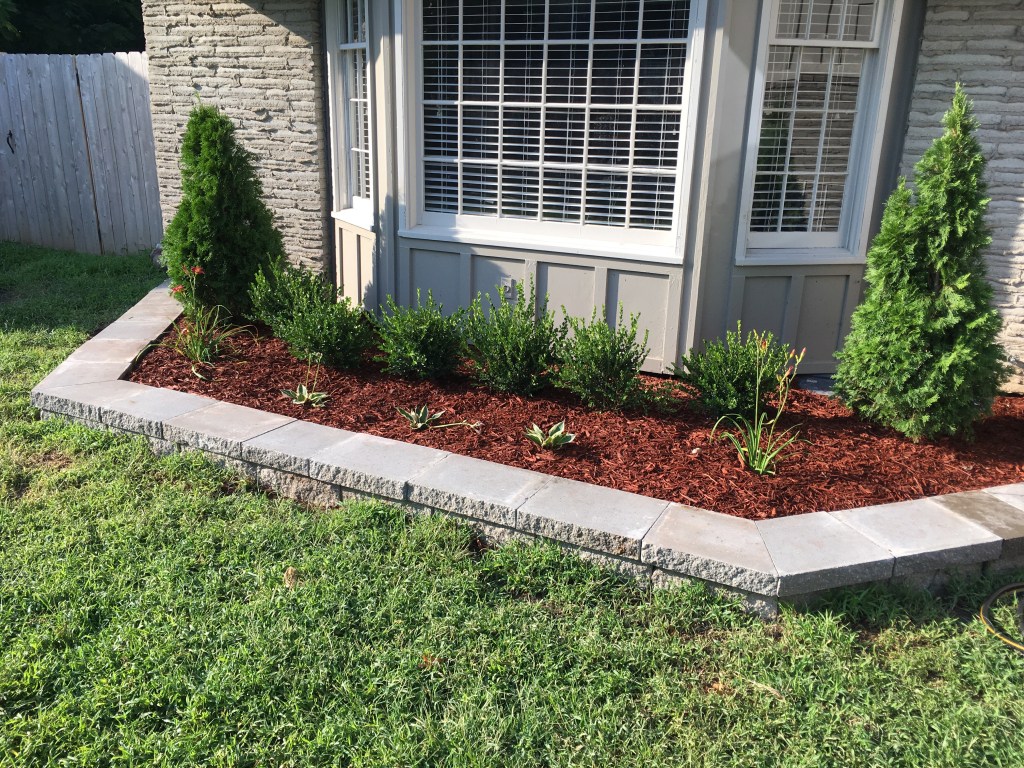 Landscape maintenance crew caring for a Kansas City property